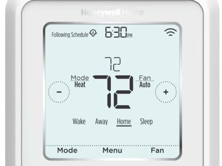 Smart thermostat set to 72 degrees on a wall